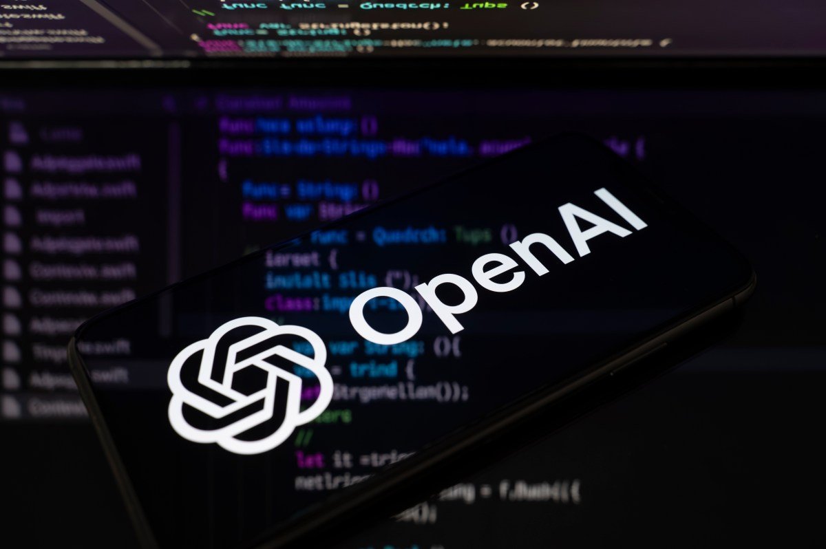 OpenAI logo mark on a code-pattern background