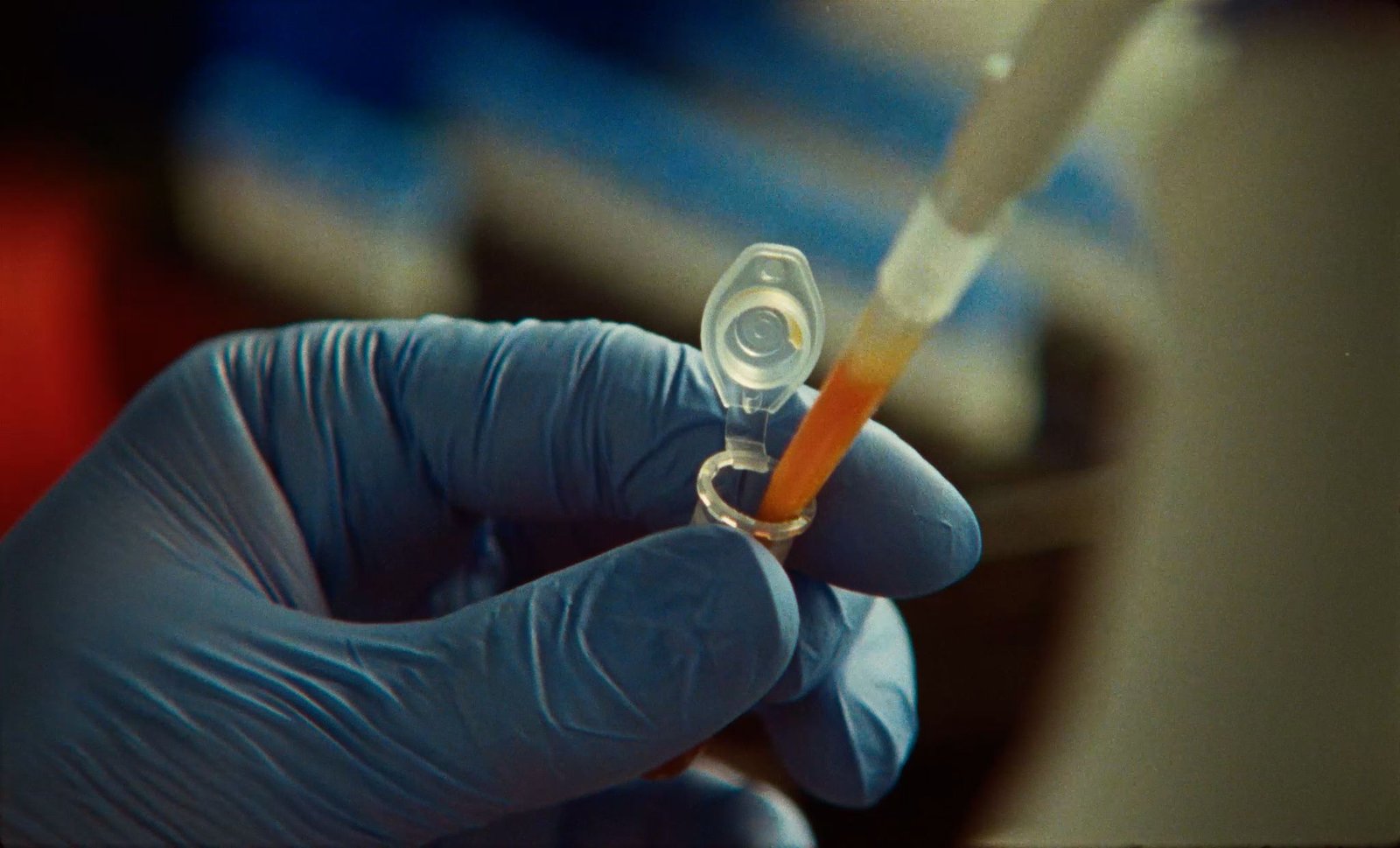 Anthropic life sciences lab — scientist pipetting (official announcement image)